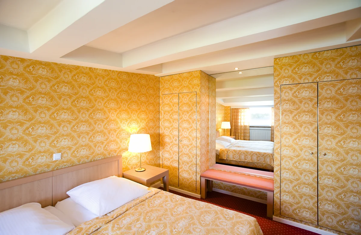 Suites – Example room · Furnishings and views vary within each category.